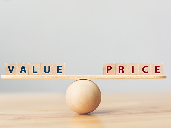A ball balancing the words value and price